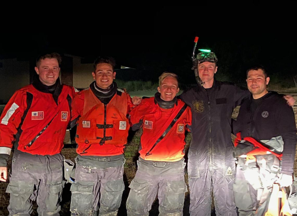 Crew members from Station Yaquina Bay gather for a photo after rescuing a fisherman from 10-foot breaking seas near South Beach State Park south of Newport, OR, early Tuesday, Sep. 8. The Coast Guard exhausted several asset options before a ground crew ultimately reached the distressed mariner. Shown are BM2 Tyler Hurst, BM3 Matthew Roque, MK2 Rachel Robbins, BM1 Wallace Qual, and BM1 Jacob Hylkema. (U.S. Coast Guard photo by Station Yaquina Bay)